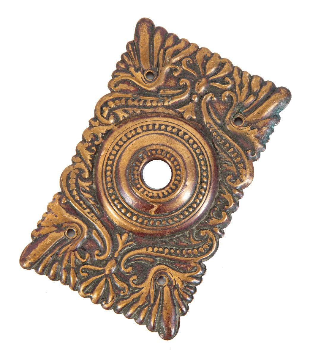 early 20th century original ornamental wrought bronze doorbell push button backplate with nicely aged surface patina