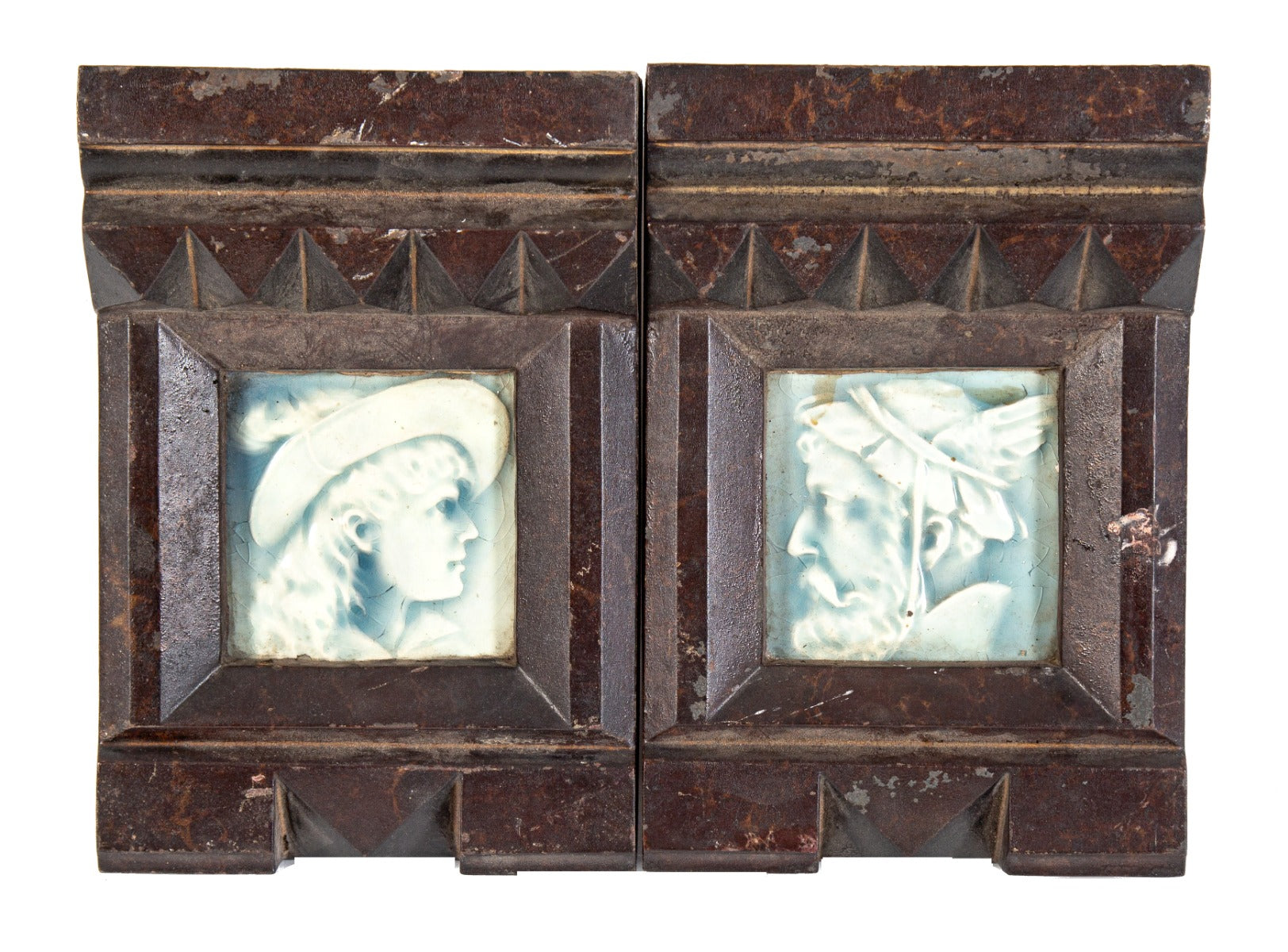 pair or set of original 19th century american ornamental oversized cast iron fireplace mantel keystones integrated with figural tiles