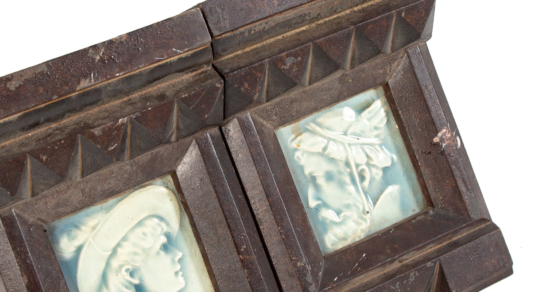 pair or set of original 19th century american ornamental oversized cast iron fireplace mantel keystones integrated with figural tiles