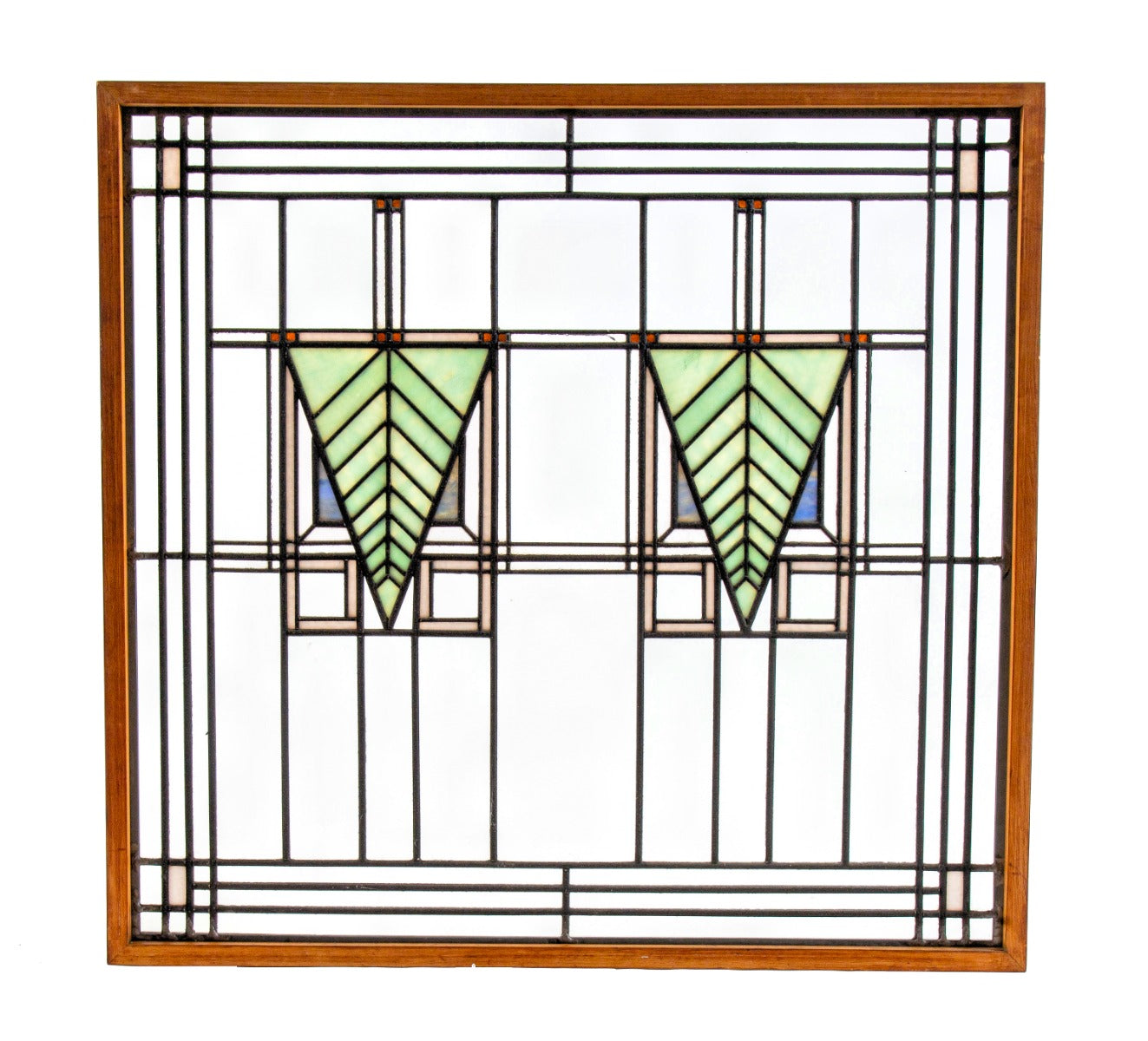 one of two matching strongly geometric early 20th century prairie style art glass window in the manner of george grant elmslie