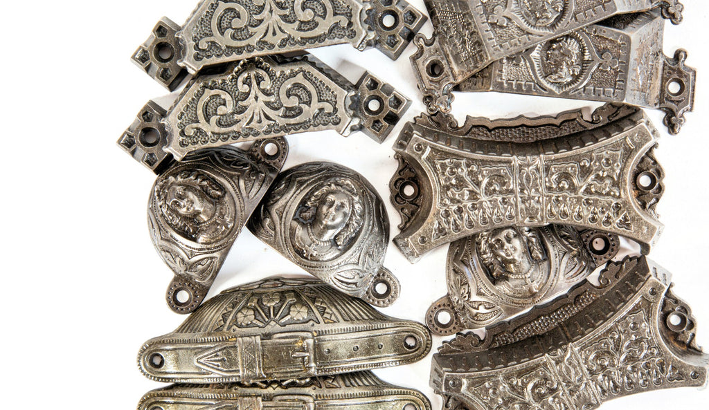 three matching 1870s salvaged chicago uniquely shaped ornamental cast iron "jenny lind" figural drawer pulls