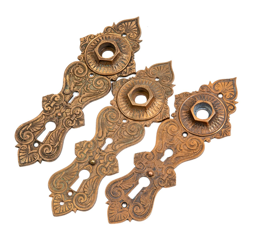 group of three matching 1870s ornamental cast bronze metallic compression casting company entrance door backplates