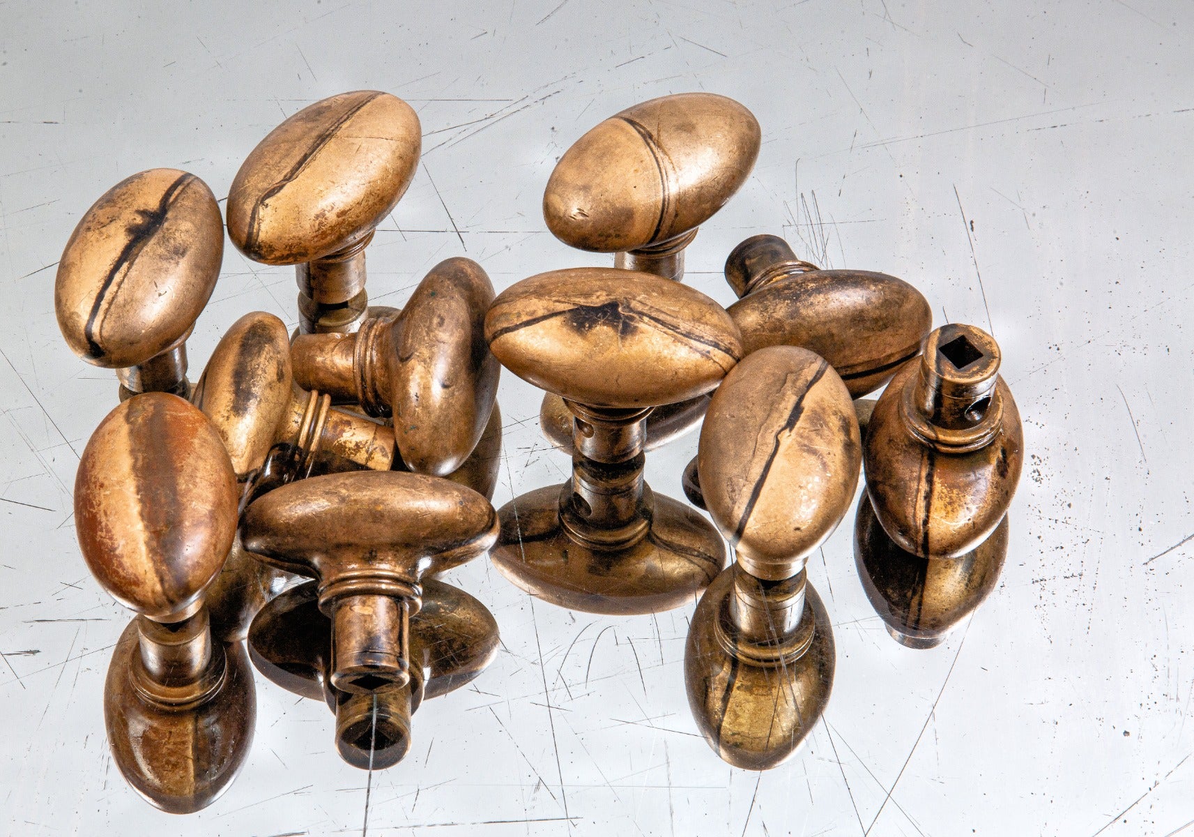 large lot of hard to find 1880s solid ornamental cast bronze oval-shaped residential doorknobs with collared shanks