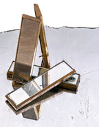 group of matching original civic opera house or building interior passenger elevator operator wall-mounted mirrors