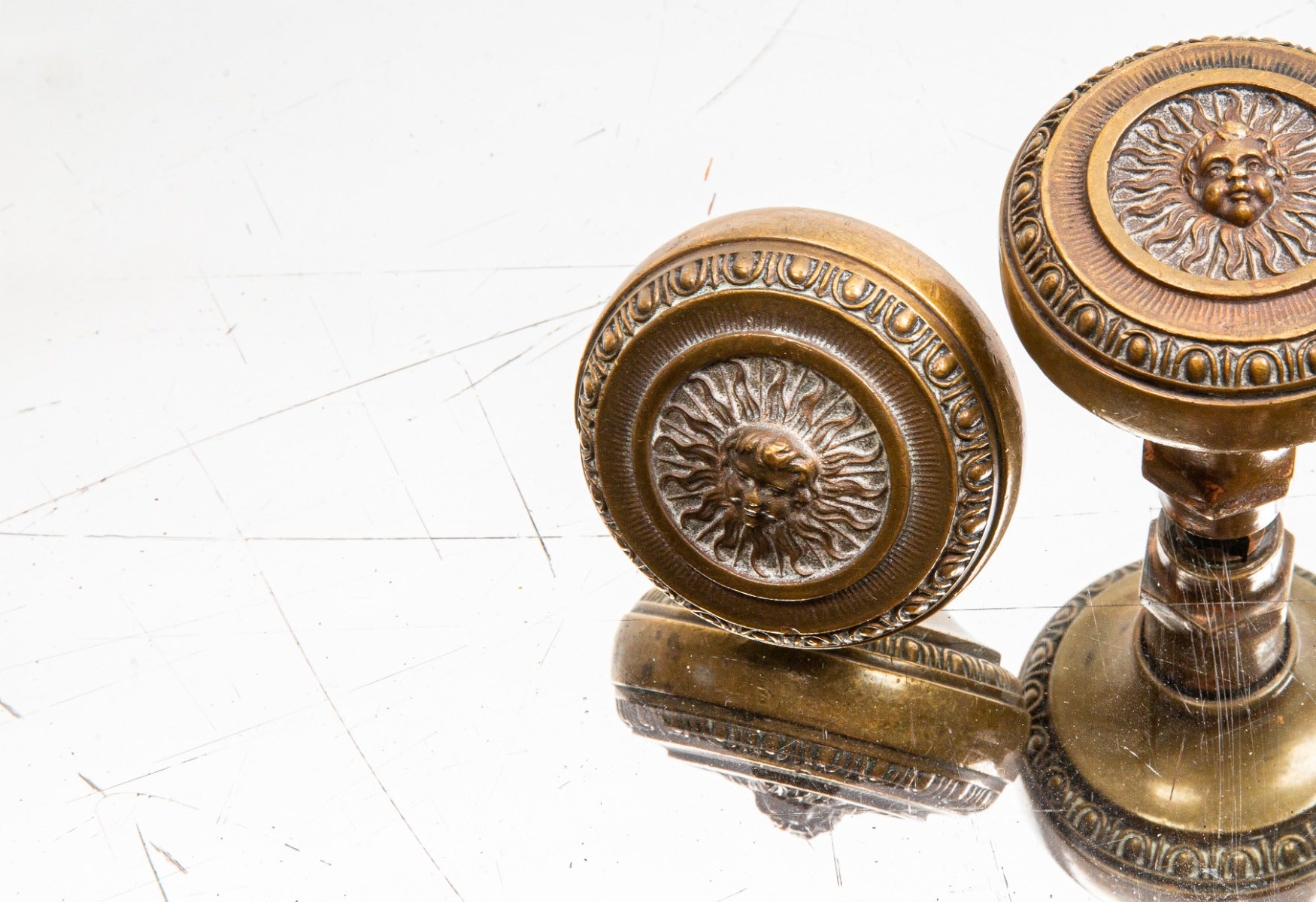 one of two matching custom-designed early 20th century cast bronze land, title and trust building doorknobs designed by d.h. burnham and company