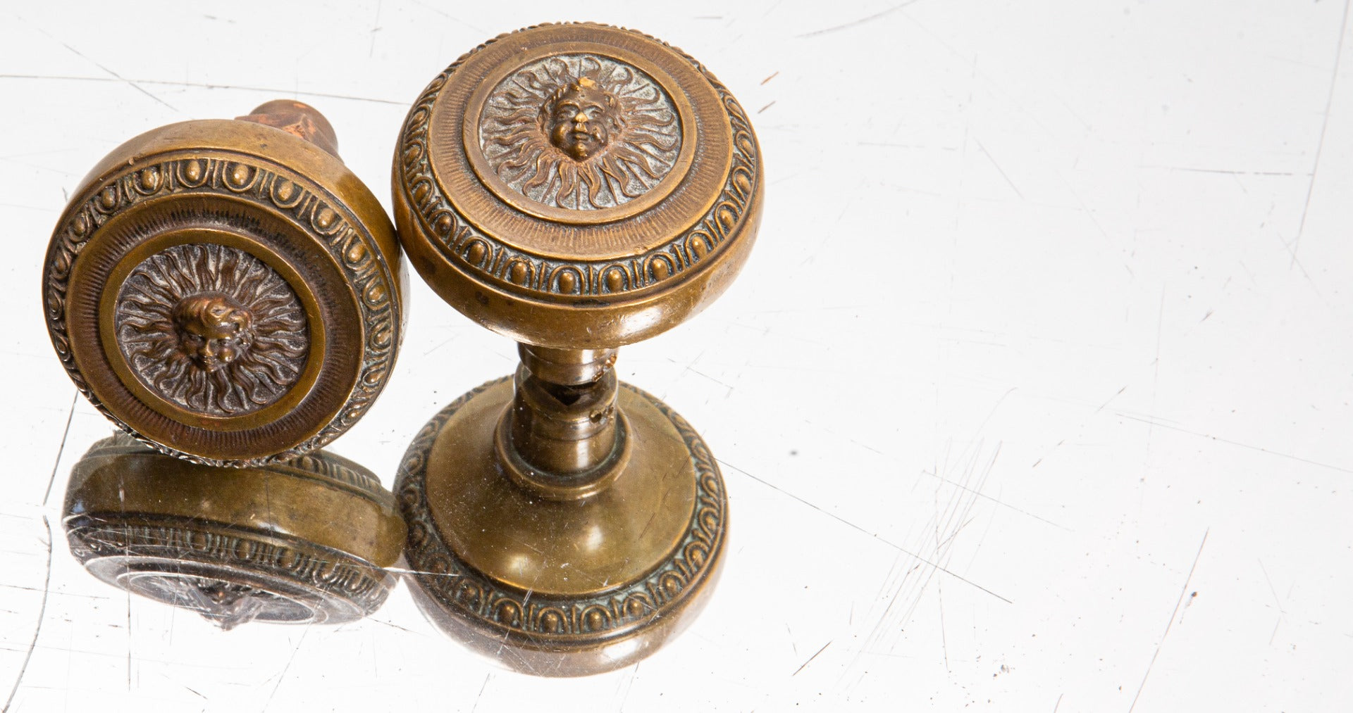 one of two matching custom-designed early 20th century cast bronze land, title and trust building doorknobs designed by d.h. burnham and company