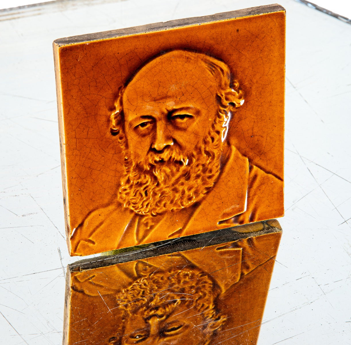 distinctive 19th century original majolica glazed brownish-orange figural fireplace portrait tile of bearded man