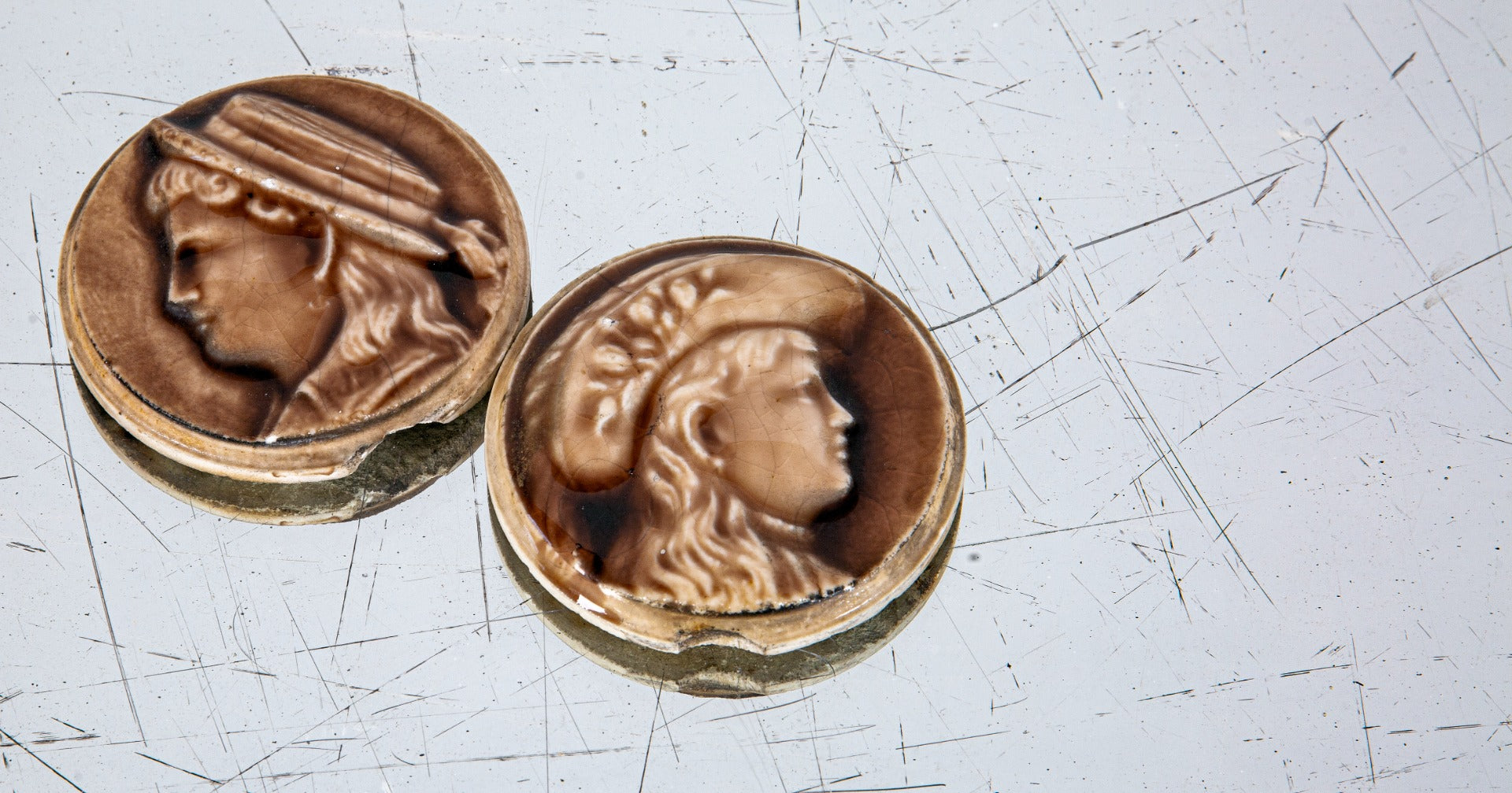 matching set of 19th century diminutive victorian-era majolica glazed round stove figural tiles