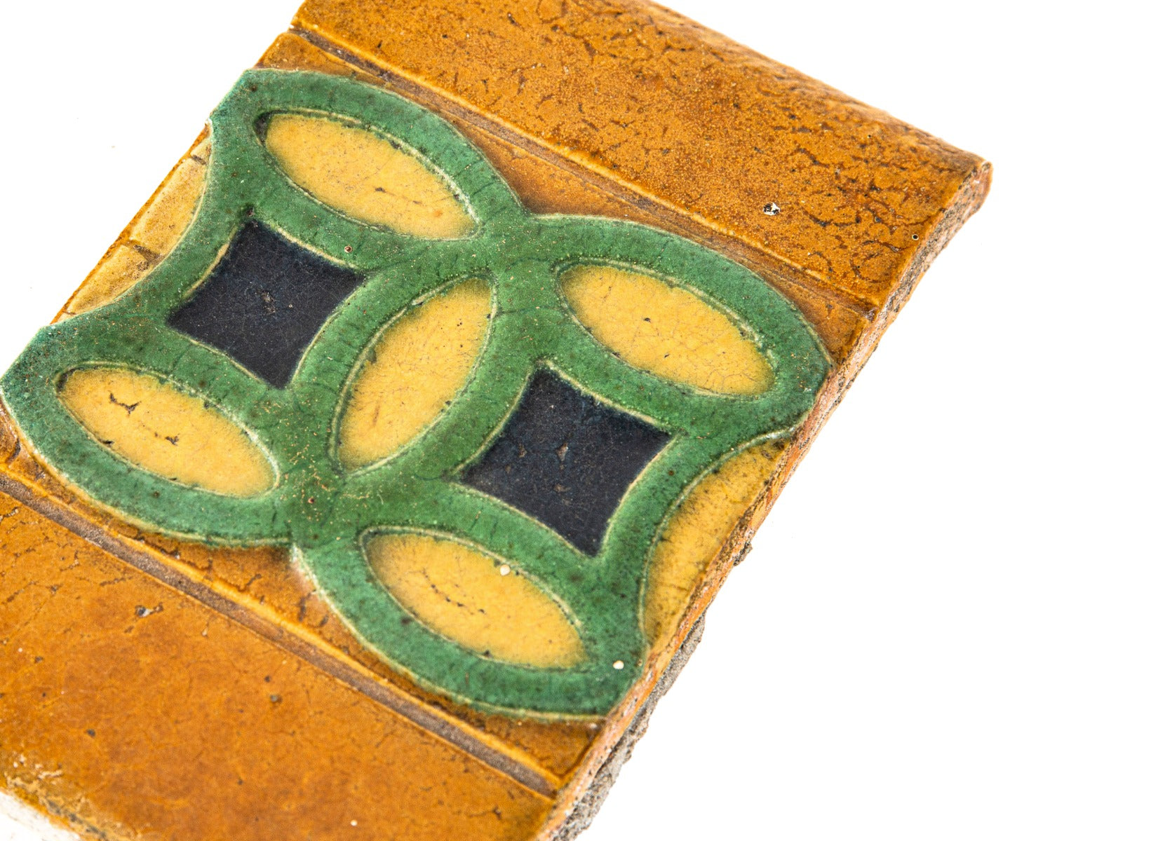 original claude bragdon-designed strongly geometric new york central station grueby tile with richly colored glaze