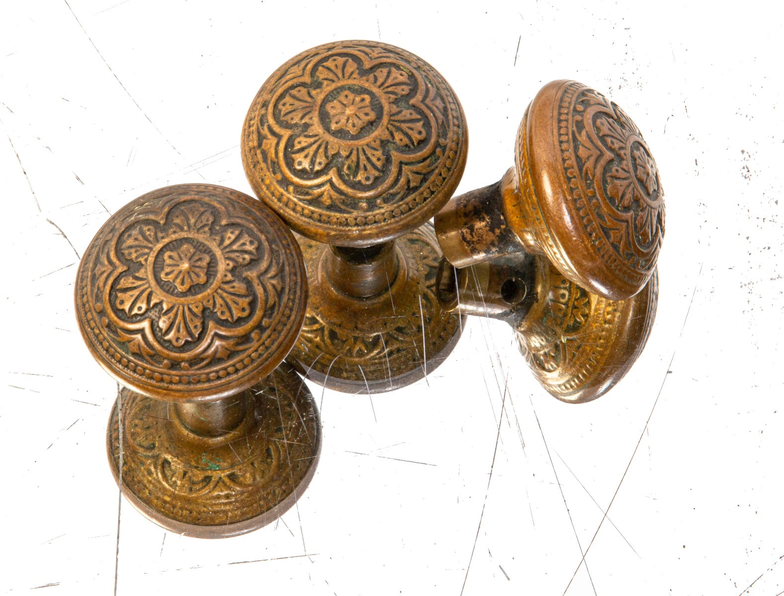 group of three matching 19th century ornamental cast brass p.f. corbin victorian style passage doorknobs