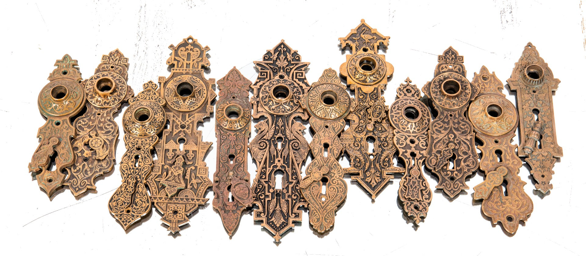 late 19th century exterior ornamental cast bronze residential entrance door backplates with swinging keyhole covers