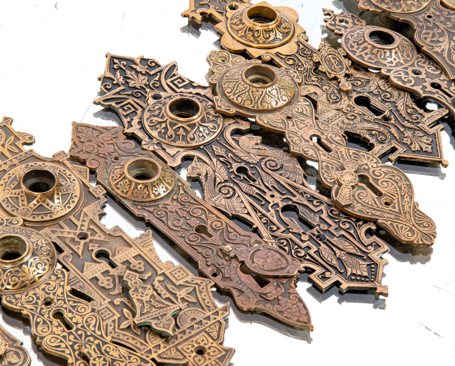 late 19th century exterior ornamental cast bronze residential entrance door backplates with swinging keyhole covers