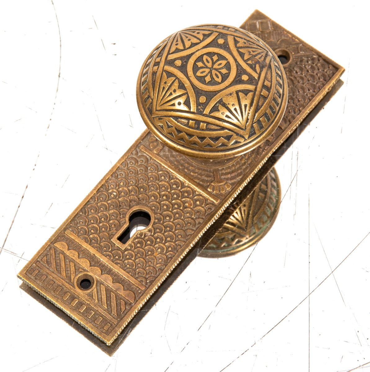 original 1880s antique american eastlake style f.c. linde cast brass doorknob and backplate with nicely aged patina