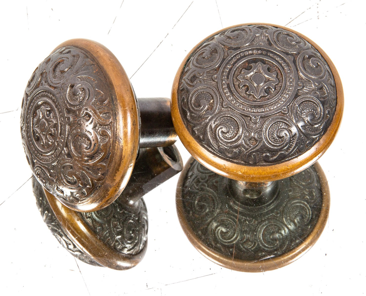 matching set of original 1870s antique american salvaged chicago cast iron doorknobs with banded brass rings