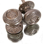 original 1870s antique american victorian-era uniquely-shaped "clara burton" figural cast iron doorknobs with matching rosettes