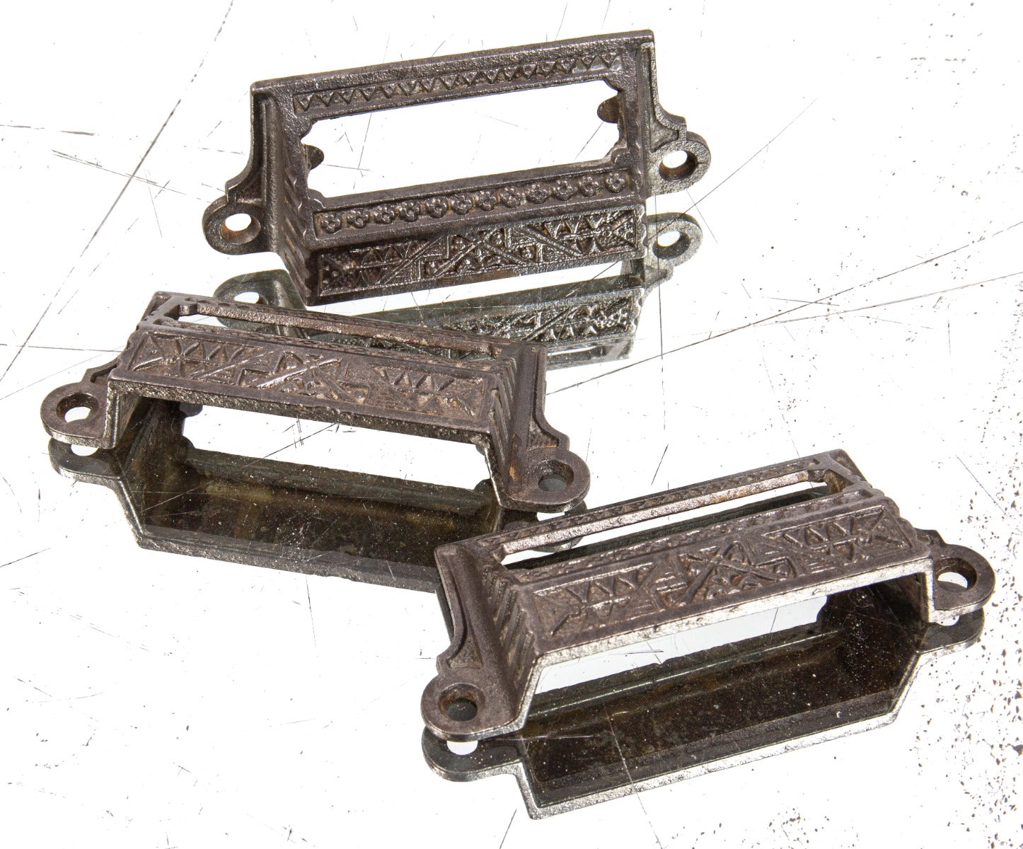 group of three matching 1880s refinished ornamental salvaged cast iron apothecary cabinet drawer pulls