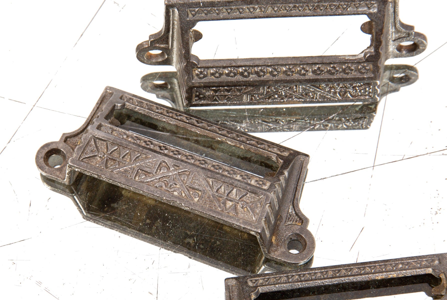 group of three matching 1880s refinished ornamental salvaged cast iron apothecary cabinet drawer pulls