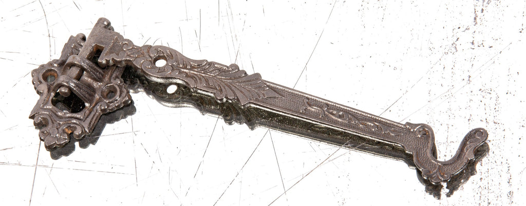 unusual antique american 19th century oversized wall-mount oversized ornamental cast iron pivoting hook