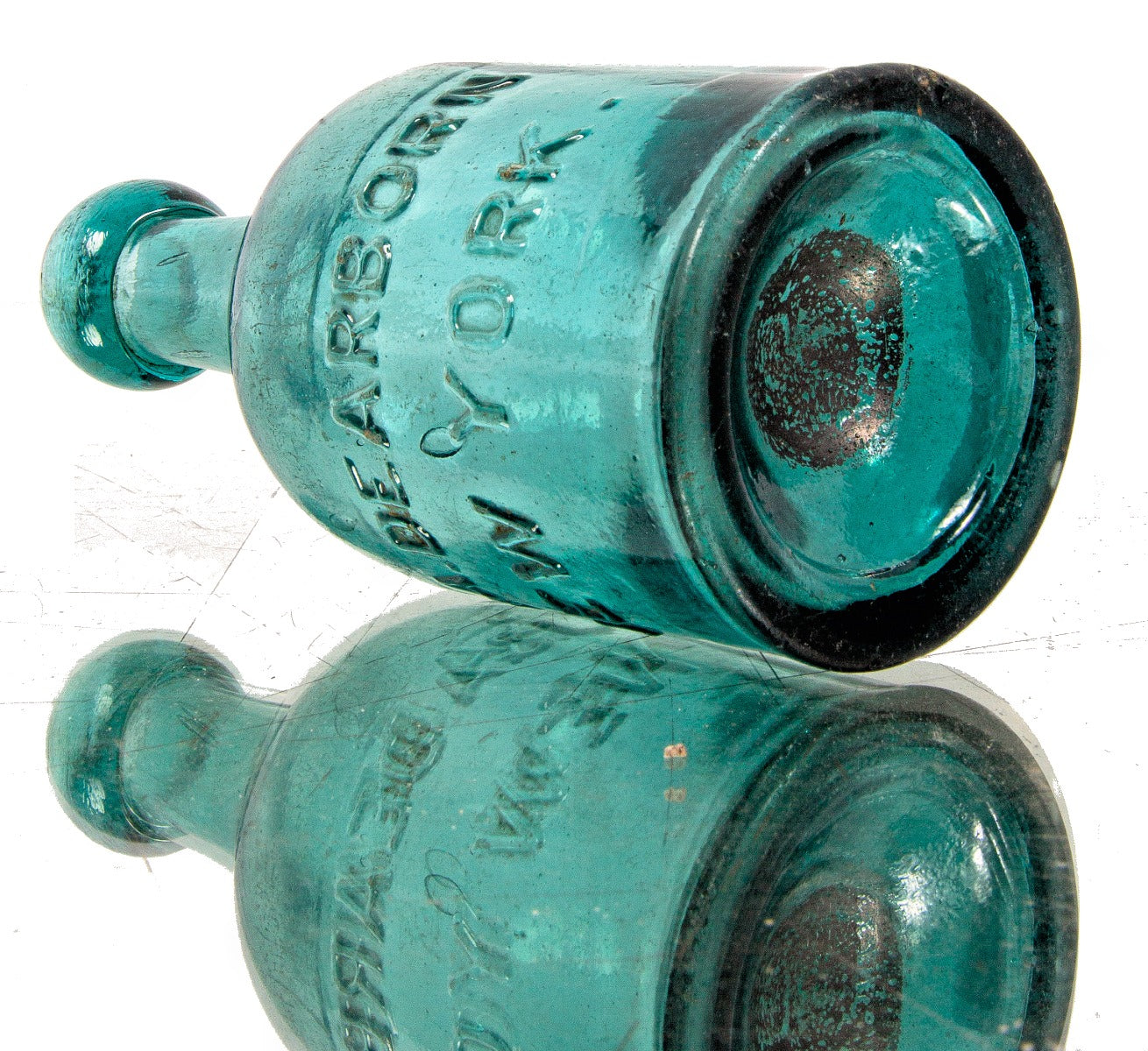 rare early to mid-1850's medium teal pontiled porter-shaped privy dug bottle with applied blob top manufactured for john and alexander dearborn in new york.