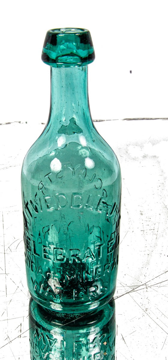 mid-nineteenth century green privy dug american iron-pontiled soda bottle with tapered blobtop manufactured for new york bottler john tweddle jr