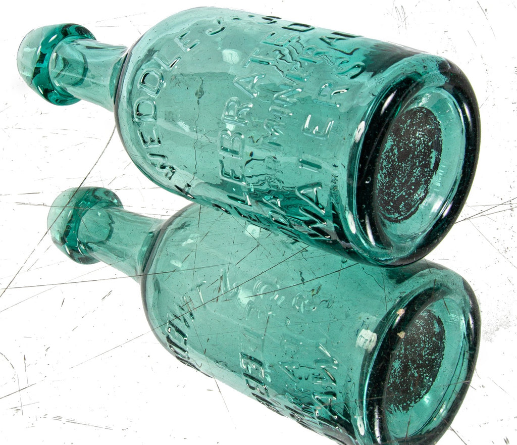 mid-nineteenth century green privy dug american iron-pontiled soda bottle with tapered blobtop manufactured for new york bottler john tweddle jr