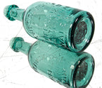 mid-nineteenth century green privy dug american iron-pontiled soda bottle with tapered blobtop manufactured for new york bottler john tweddle jr
