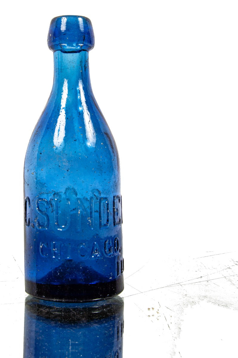 hard to find cornflower blue glass mid to late 1850's iron pontiled soda glass bottle with deeply embossed lettering and applied blob top