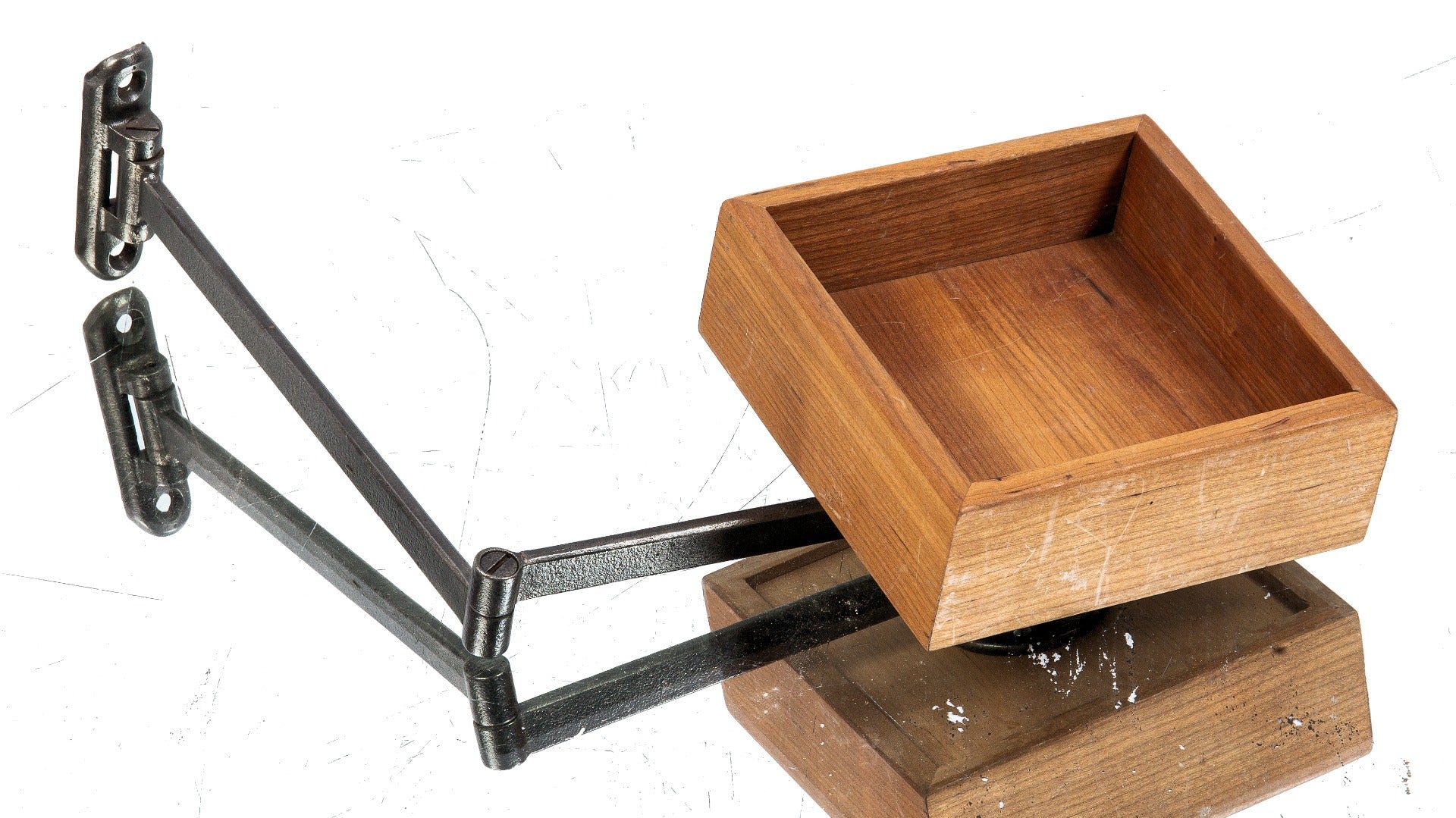 repurposed wall-mount cast iron swing-out cast iron brushed metal bracket supporting varnished wood card tray