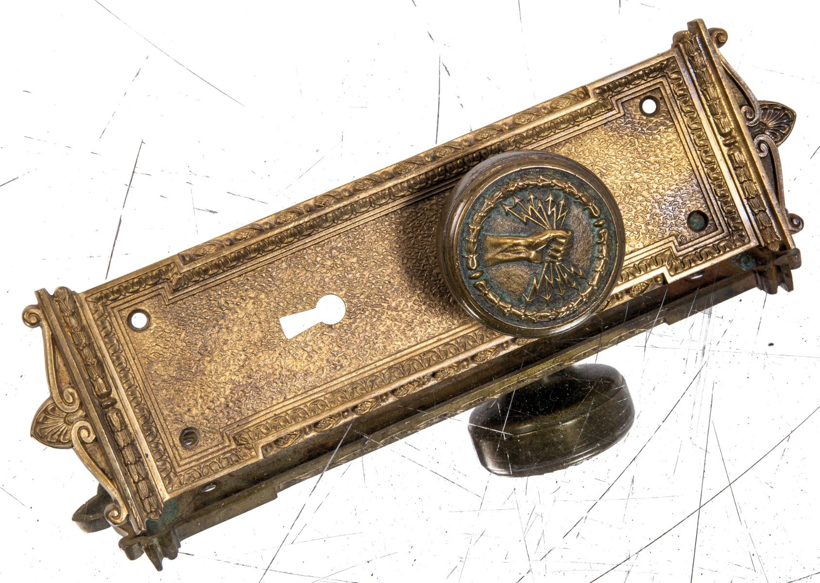 early 20th century custom-designed ornamental cast bronze milwaukee electric railway and light company doorknob and matching backplate