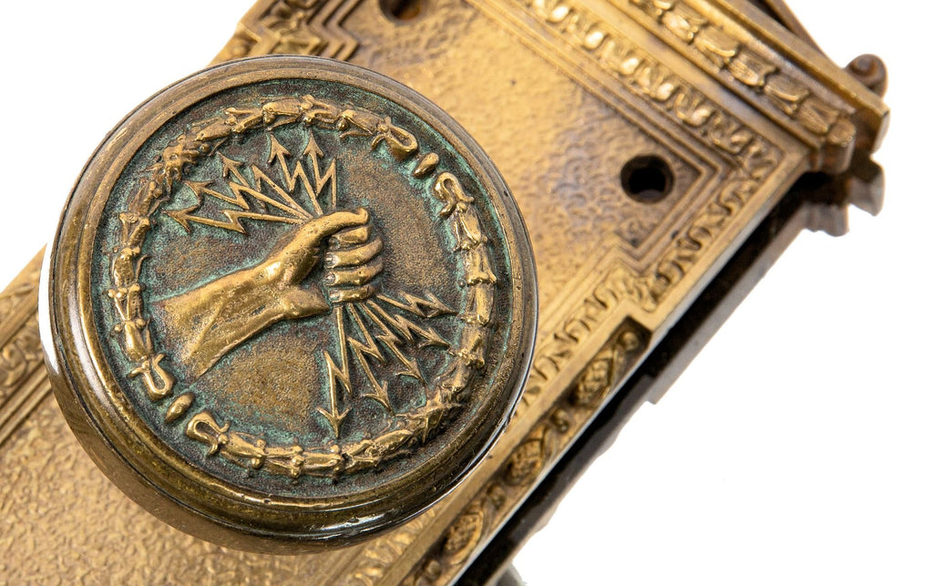 early 20th century custom-designed ornamental cast bronze milwaukee electric railway and light company doorknob and matching backplate