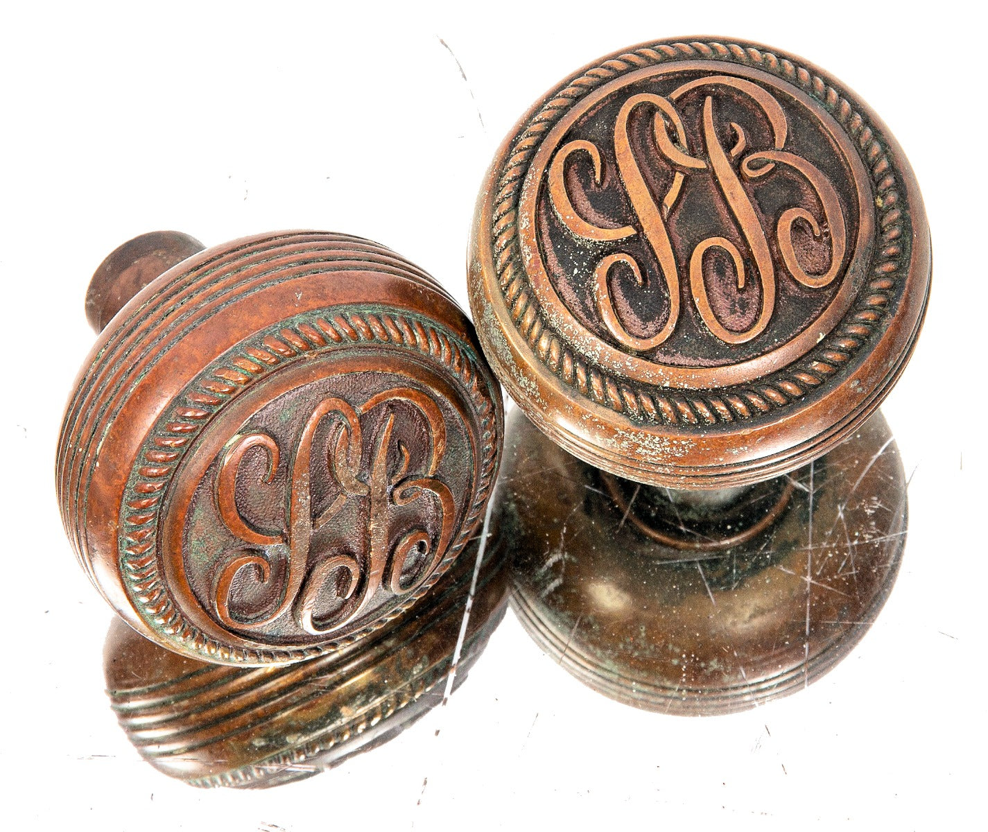 late 19th century original ornamental cast brass commercial building monogrammed doorknobs with fanciful lettering