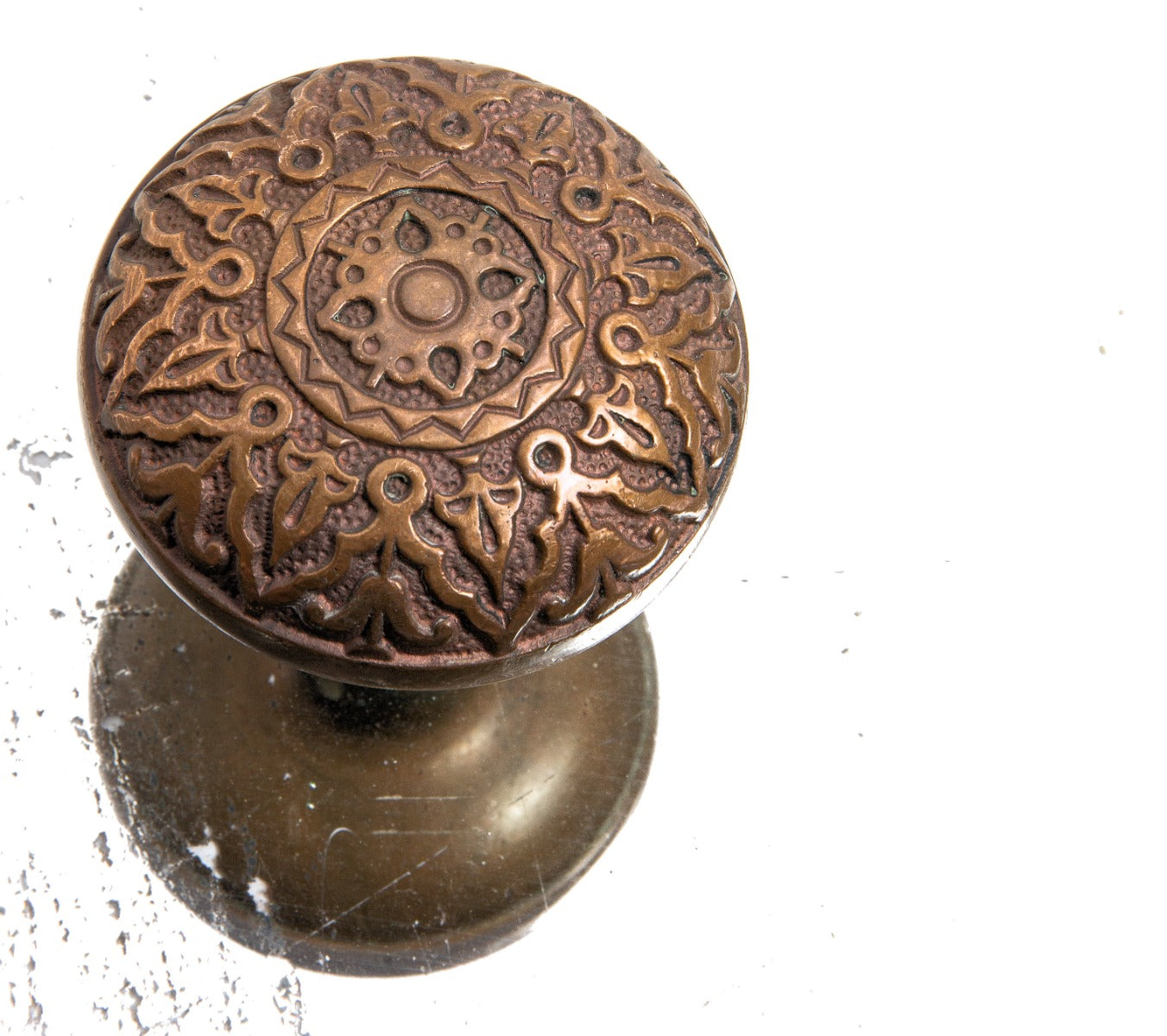 late 1870s original single ornamental cast brass residential doorknob with banded rim and dimpled field pattern