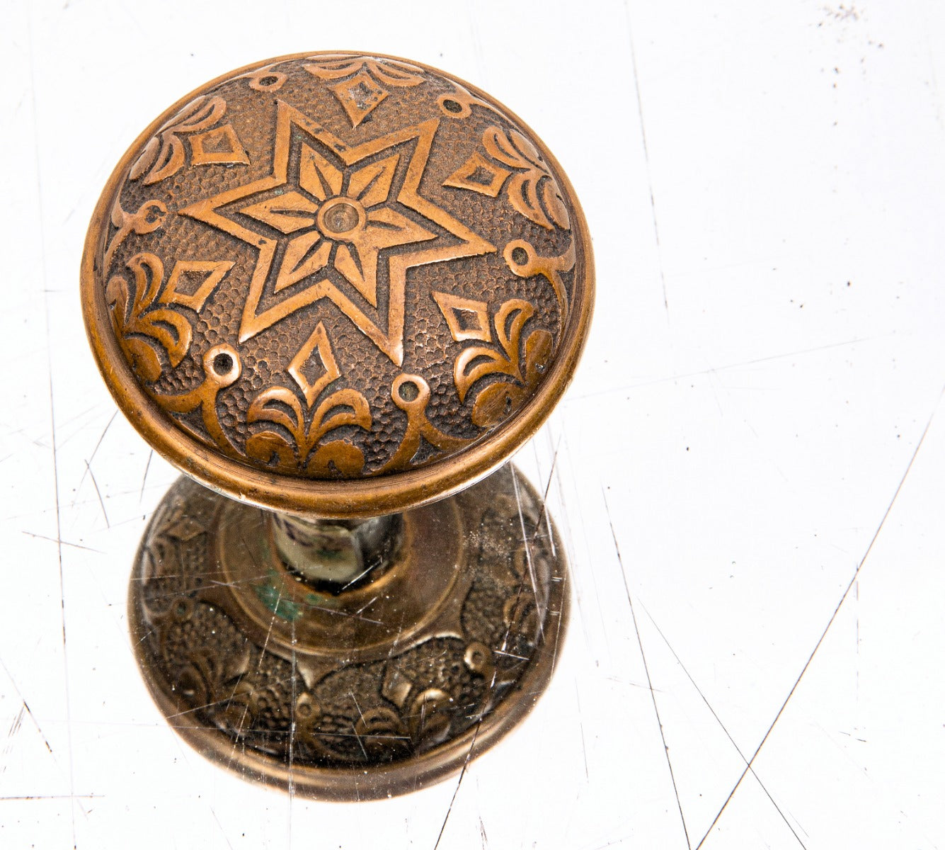single 1890s ornamental cast brass phoenix lock works banded rim doorknob with nicely aged patina