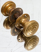 latre 19th century adams & westlake cast bronze saloon door handles with lightly incised concentric  circle