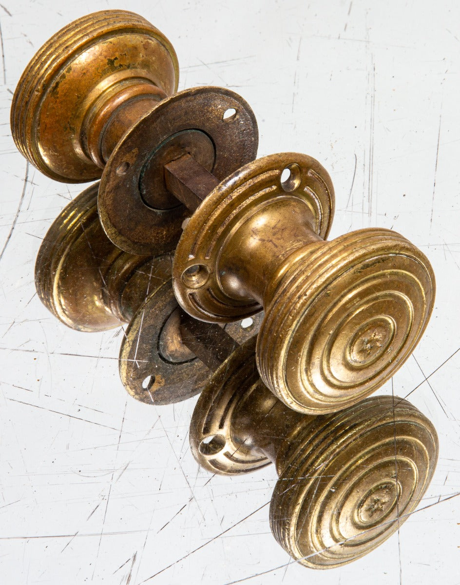 latre 19th century adams & westlake cast bronze saloon door handles with lightly incised concentric  circle