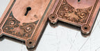 matching set of late 19th century romanesque style cast bronze salvaged chicago doorknob backplates by yale & towne mfg. co.