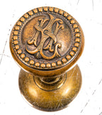 original 19th century ornamental cast brass monogrammed guestroom doorknob designed for clinton j. warren's lexington hotel