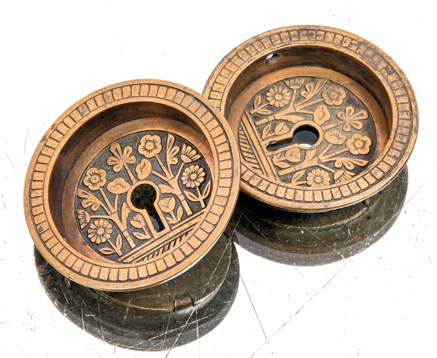 pair of 1880s original salvaged chicago anglo-japanese style ornamental cast bronze circular-shaped pocket door pulls