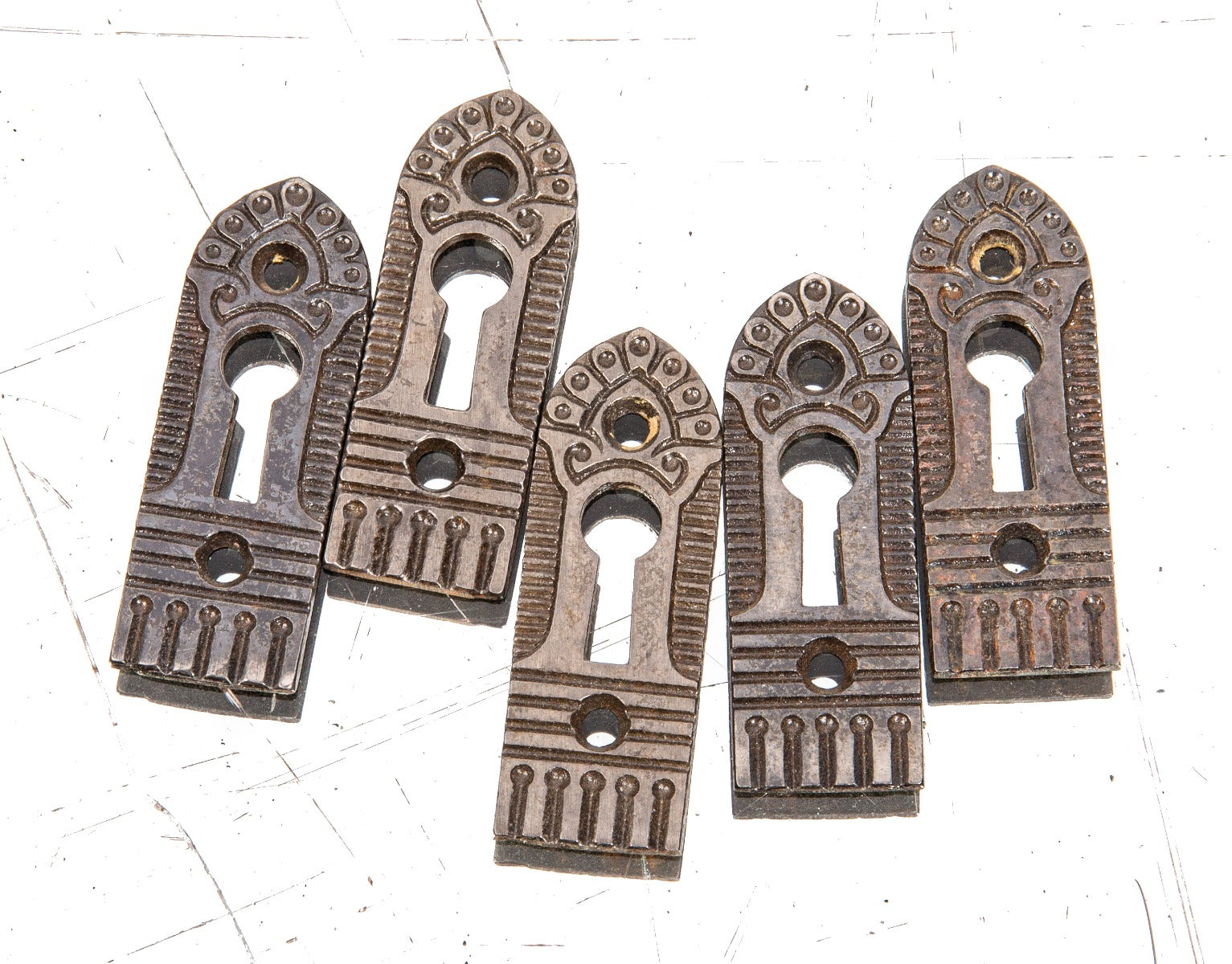 group of five matching refinished 1880s ornamental cast iron interior residential salvaged chicago door keyplates