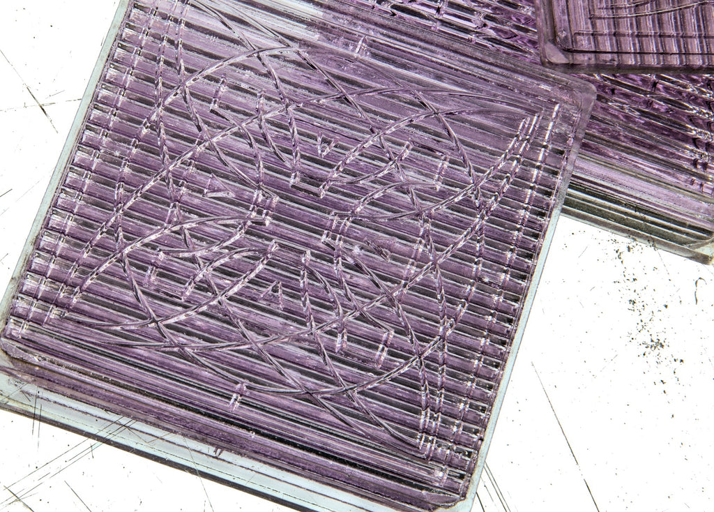 three matching early 20th century frank lloyd wright-designed sun-purple exterior building prismatic glass tiles