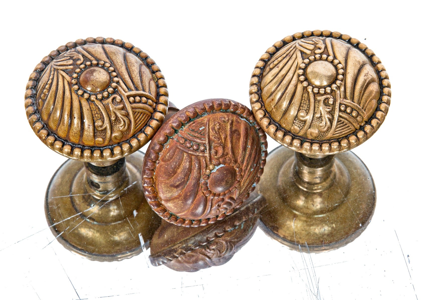 three original early 20th century ornamental wrought bronze "roanoke" pattern salvaged chicago doorknobs