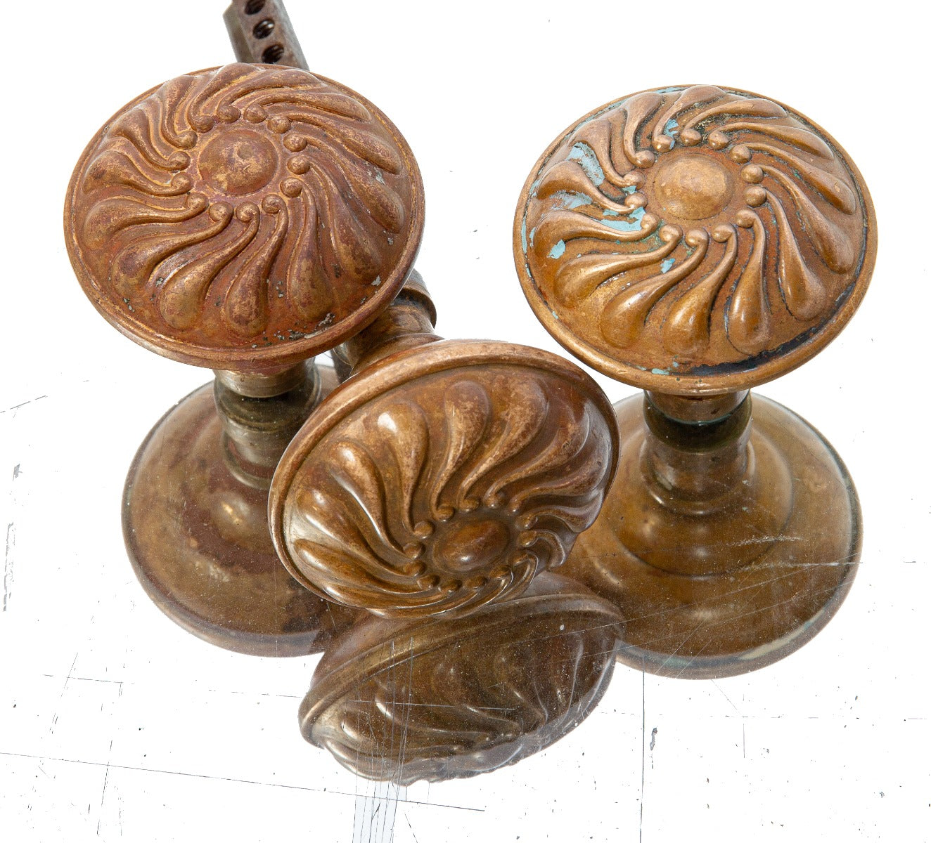 group of three matching 1890s wrought ornamental bronze "pinwheel" salvaged chicago doorknobs