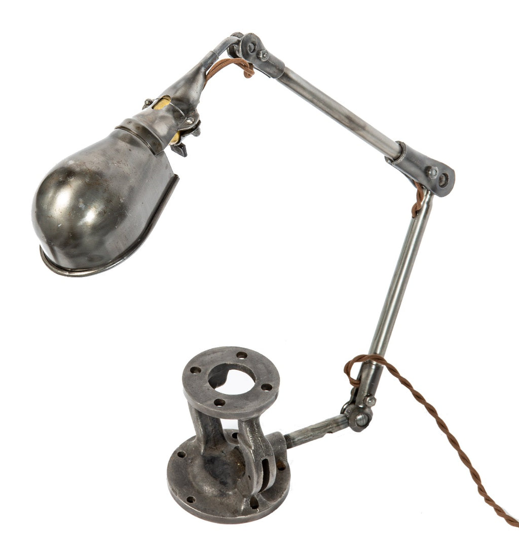 refinished and rewired articulating ball-joint adjustable lamp with cast iron bonnet base for display