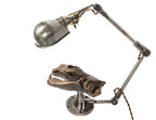 refinished and rewired articulating ball-joint adjustable lamp with cast iron bonnet base for display