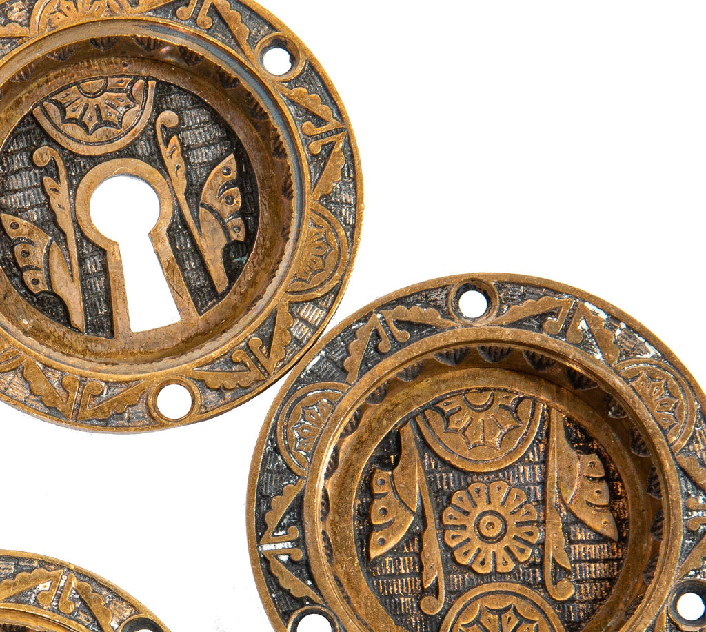 four matching 19th century eastlake style ornamental cast bronze circular-shaped salvaged chicago pocket door backplates