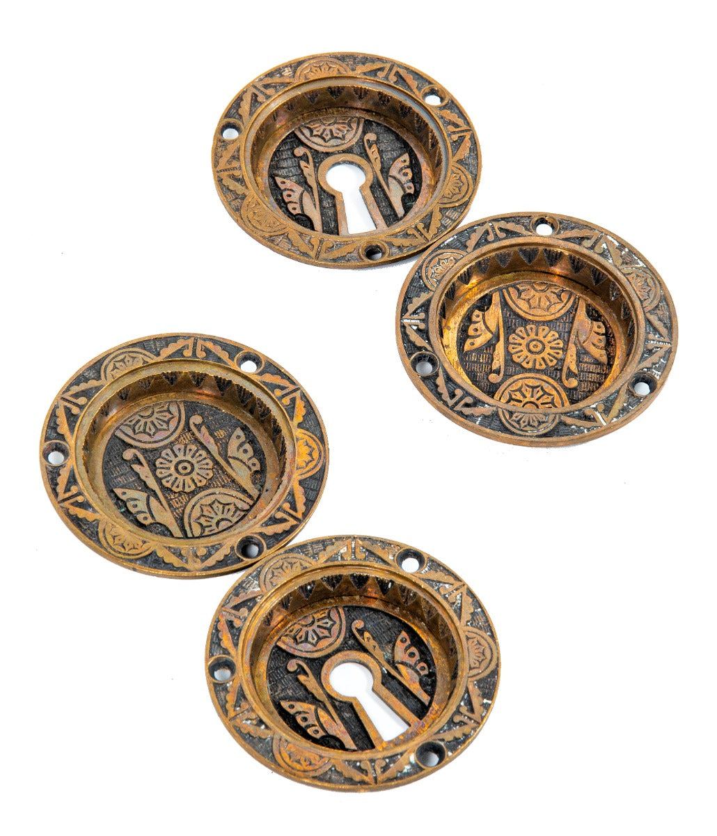 four matching 19th century eastlake style ornamental cast bronze circular-shaped salvaged chicago pocket door backplates