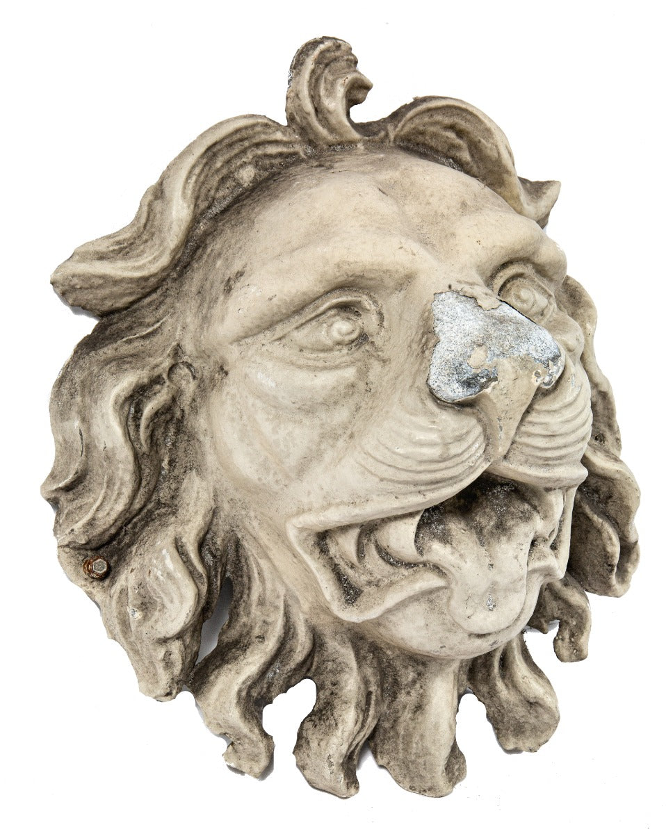 early recast of oversized lionhead used during renovation of george j. johnson's iron block (1860)