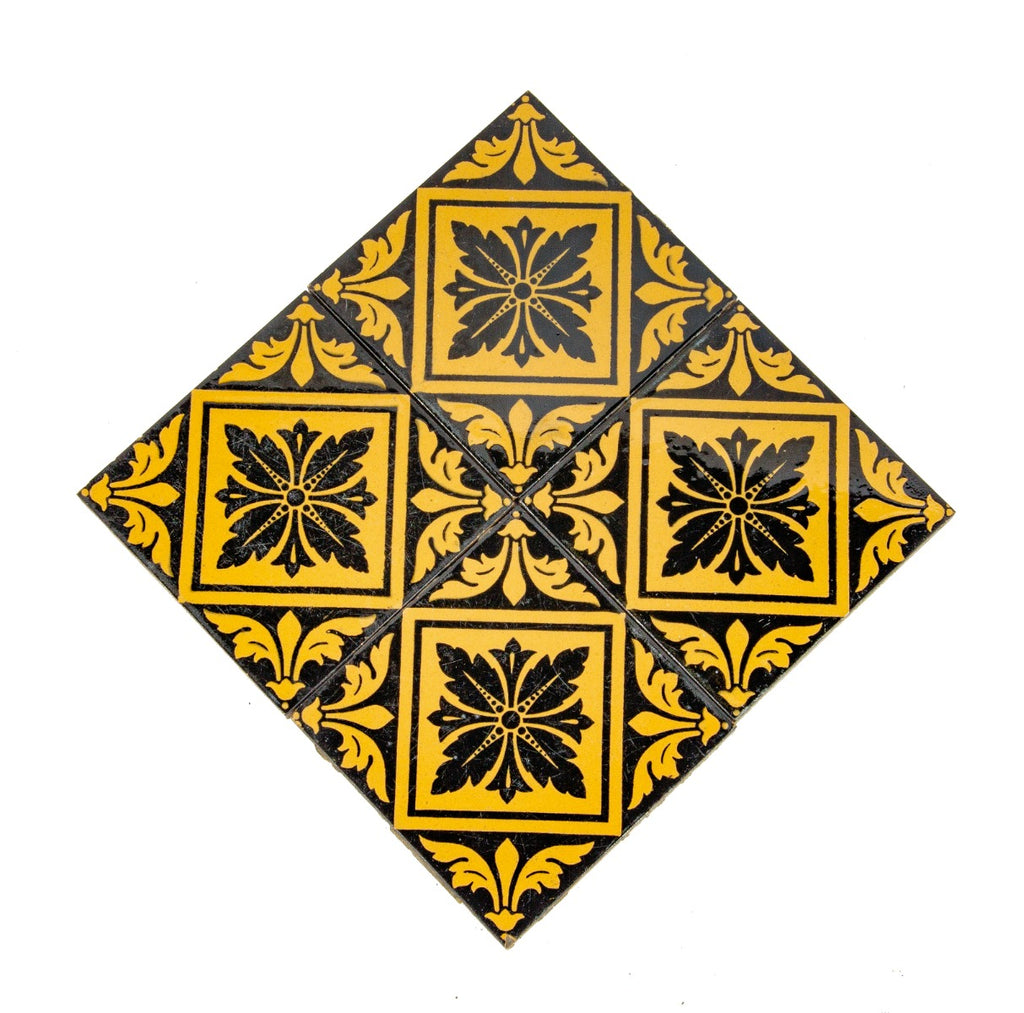 group of four matching exterior salvaged chicago black and yellow glazed 1870s facade tiles