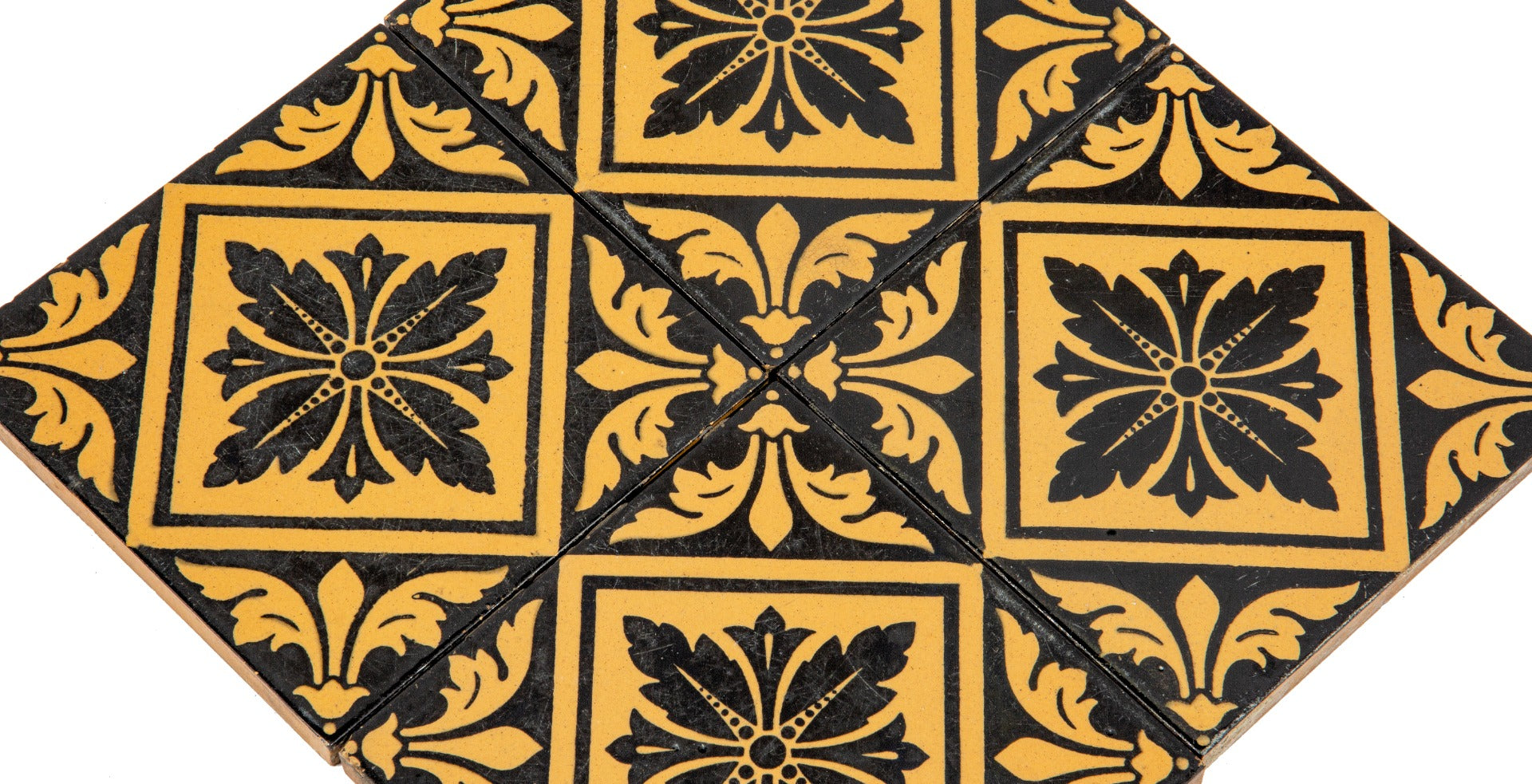 group of four matching exterior salvaged chicago black and yellow glazed 1870s facade tiles