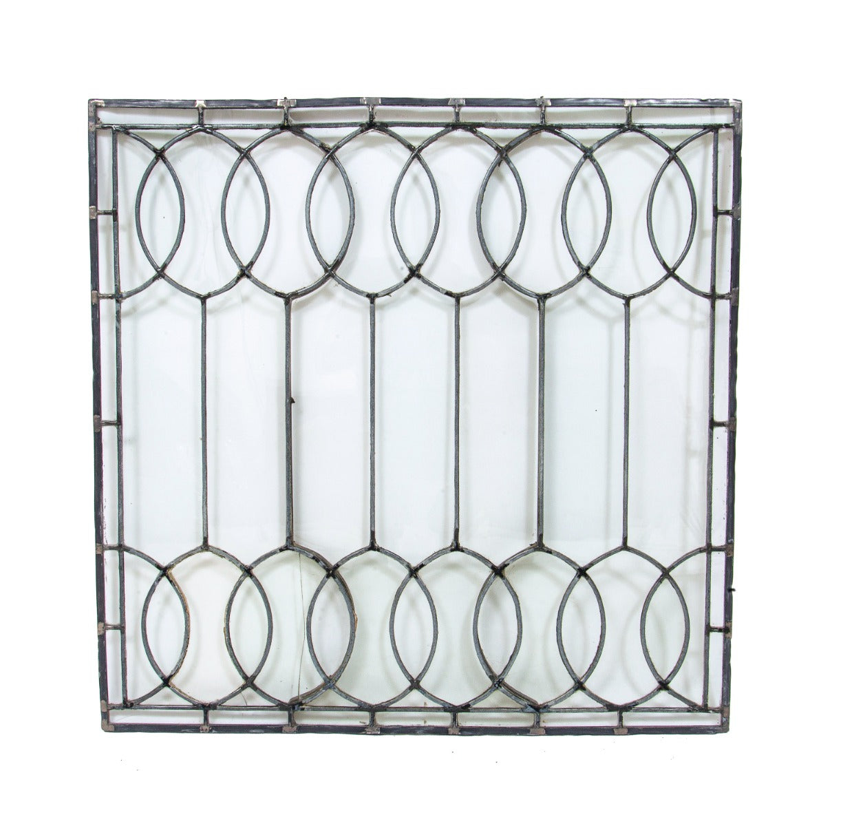 important late 19th century strongly geometric leaded clear glass robert p. parker "bootleg" house window featuring bands of overlapping ovals